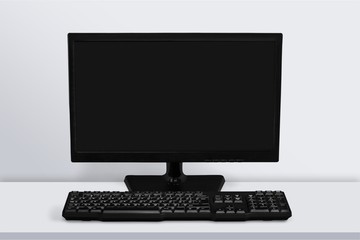 Desktop computer and keyboard on background