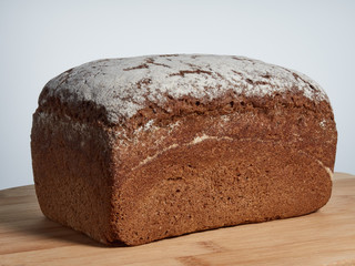 loaf of rye bread on a wooden board