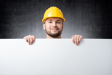 Worker holding blank board