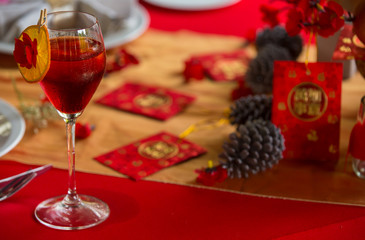 Chinese New Year dinner place setting with decorations.