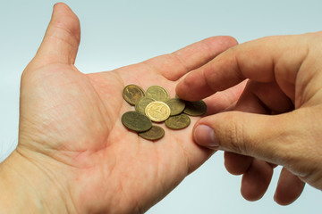 Soviet pennies in hand as a symbol of poverty