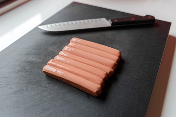 sausages on a cutting board close up
