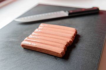 sausages on a cutting board close up