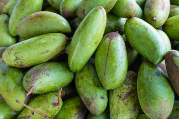Fresh green mango pile thai cultivars in market at Mae Hong Son, Thailand
