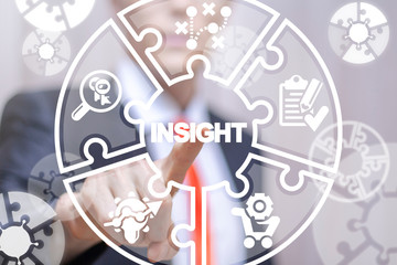 Young businessman working on a virtual screen of the future and touches the inscription: INSIGHT. Insights idea business finance marketing concept.