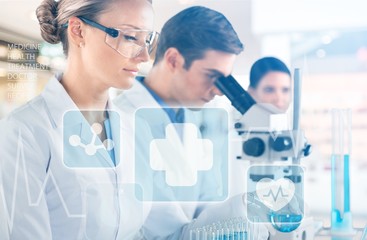 Female and male scientists in glasses working with microscope