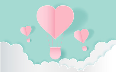 Fototapeta na wymiar love and valentine day,Origami made hot air balloon flying on the sky with heart float on the sky.paper art 