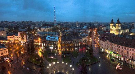 Fototapeta premium Ukraine, Ivano-Frankivsk, November 26, 2017: Panorama of the small European city of Ivano-Frankivsk in western Ukraine, city center at night time