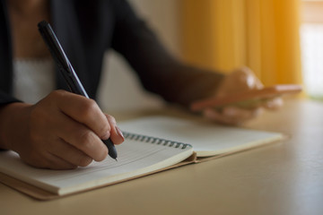 Women write product orders in notebooks, modern online media business concepts.