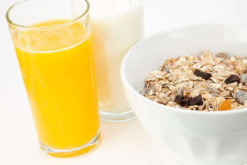 Balanced breakfast with muesli bowl and fresh orange juice