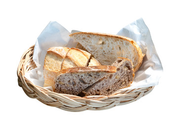 Homemade organic breads in rattan basket isolated on white background, clipping path included