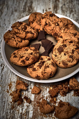 group of tasty cookies next to a bowl