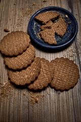 group of tasty cookies next to a bowl