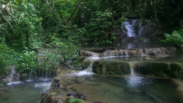 small limestone waterfall scene in the tropical rain forest