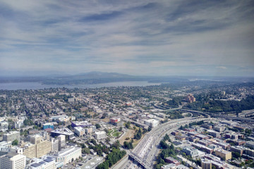 Seattle, USA - September 2, 2018: Aerial view overlooking the city skyline of Seattle Washington with mountain ranges on distant horizon.