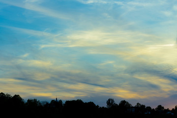 Beautiful clouds in the rays of the sunset