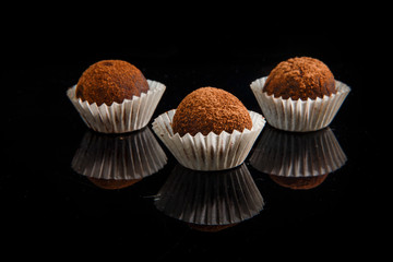 closeup three useful handmade round chocolate candies