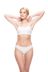 Obraz premium attractive smiling slim girl in white underwear looking away isolated on white