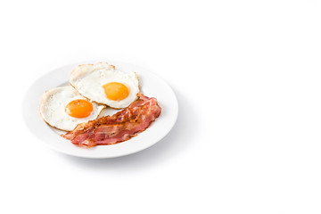Fried eggs and bacon for breakfast isolated on white background. Copyspace

