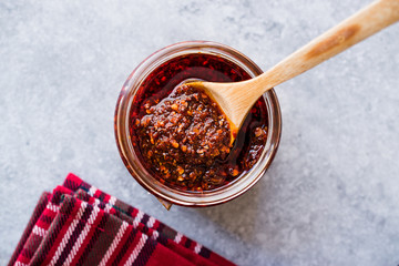 Hot Mexican Spicy Chili Red Sauce Salsa Macha with Red Pepper Powder in Jar.