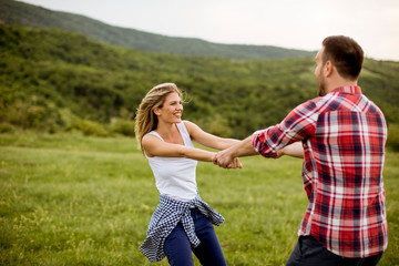 Fototapeta premium Loving coulpe having fun in the spring nature