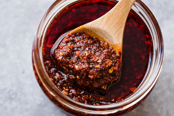 Hot Mexican Spicy Chili Red Sauce Salsa Macha with Red Pepper Powder in Jar. - obrazy, fototapety, plakaty