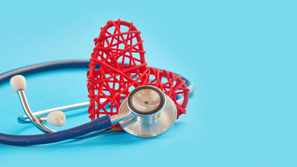 stethoscope and red heart on blue background, medical care concept, staff medical insurance