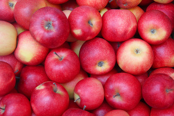 Delicious red apples as background