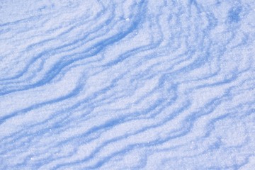 A cold winter day.Drawing on snow.Snowdrift.Abstract background.