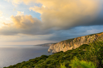 Fototapeta na wymiar Greece, Zakynthos, Beautiful rocky cliff coast and ocean decorated by glowing sky