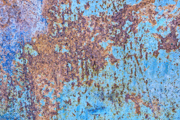 Fototapeta premium Texture of rusty iron with blue background. The metal surface rusted spots.