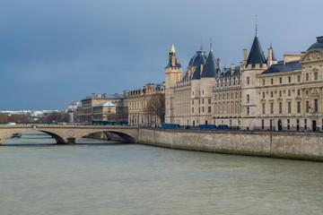 Conciergerie and bridge Change by the Seine river in Paris France. 