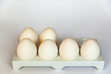 fresh chicken eggs in an ecological recycled paper container