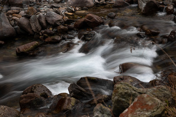 Mountain panorama with peaks, snow, villages, streams and trails