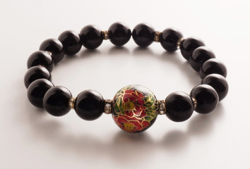 Black bead bracelet on white background