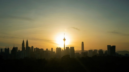 Fototapeta premium Silhouette of Kuala Lumpur city during Sunrise