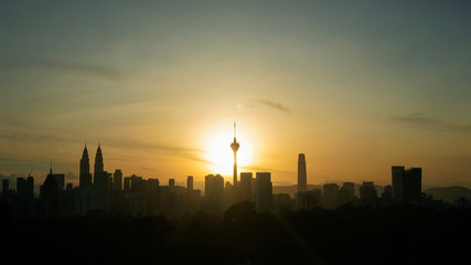 Fototapeta na wymiar Silhouette of Kuala Lumpur city during Sunrise