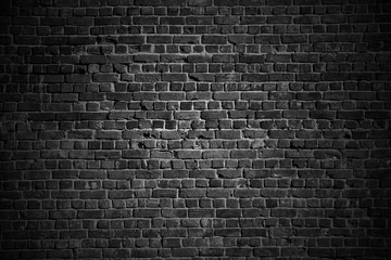 Fototapeta na wymiar Dark rough brick wall