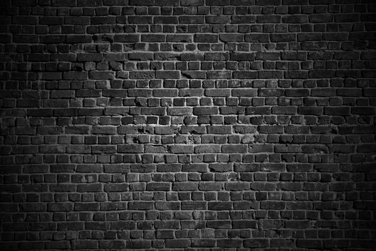 Dark rough brick wall © andrik