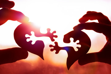 the two halves of the heart in their hands reach out to each other. love, Valentine's day.