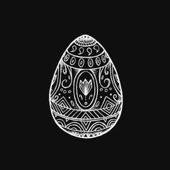 Painted hand drawn Easter egg. Doodle illustration. Egg with patterns. Can be used as a coloring page, holiday card, print.