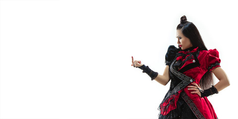 The young woman dressed in medieval style posing at studio as marquise. Fantasy, Antique, Renaissance concept