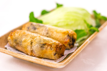 Deep fried Vietnamese Spring Rolls wrapped by fresh lettuce
