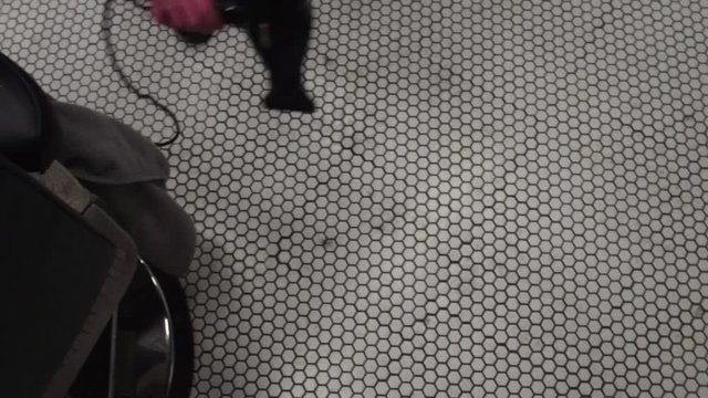 man cleaning floor with the blower