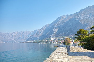 Sea water and mountains, sunny summer day with blue sky, Boka Kotor bay, Montenegro
