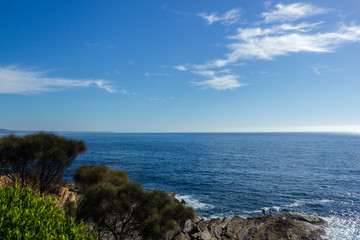 2 People on a Coastline with ocean and rocks, Australia