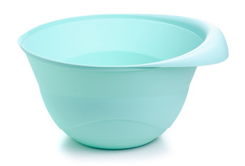 Green plastic kitchen bowl on white backgrund isolation