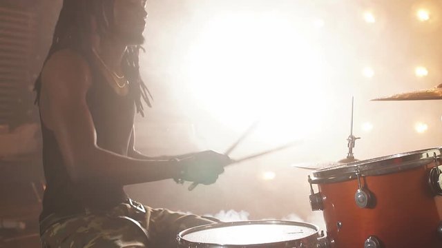 Crazy afro guy is keen on rock music. Strong music. Interest concept