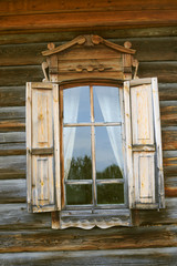 Window in wooden houses near the Lake Baikal in Siberia in Russia