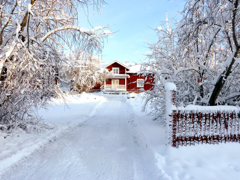 Swedish house in winter by a very bright day